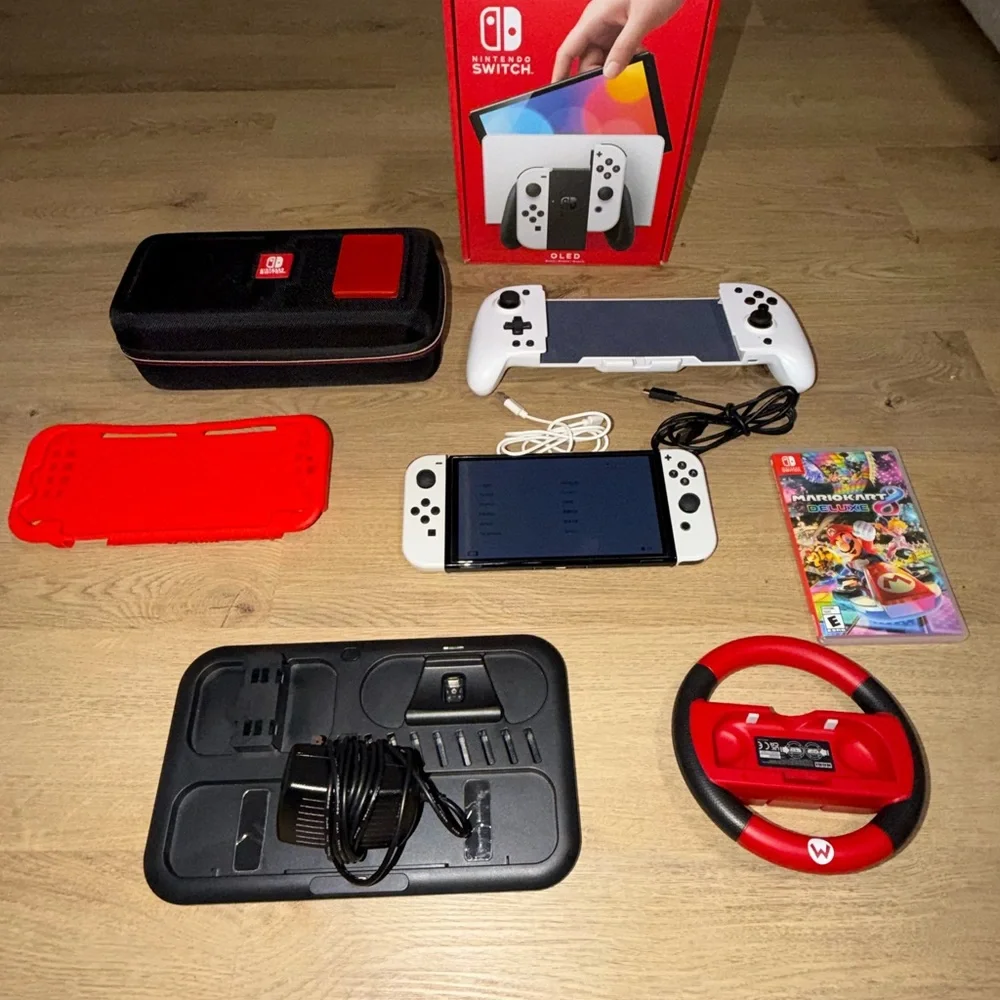Nintendo Switch OLED (White) bundle. comes with all original parts and cords.